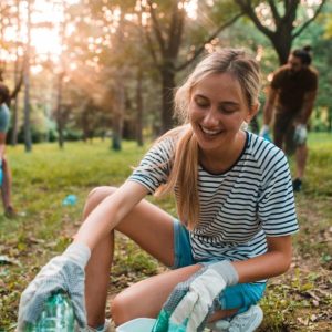 Group of young person cleaning the forest