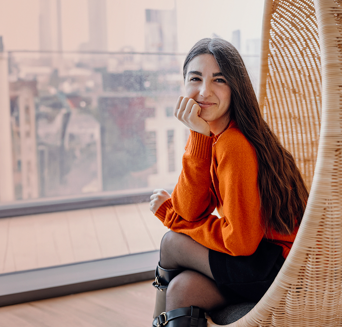 girl in an orange sweater